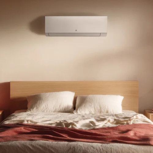 Climatiseur mural Niseko blanc dans une chambre