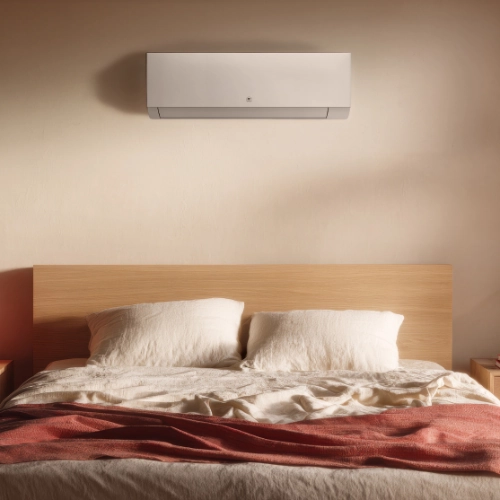 Climatiseur mural Niseko blanc dans une chambre
